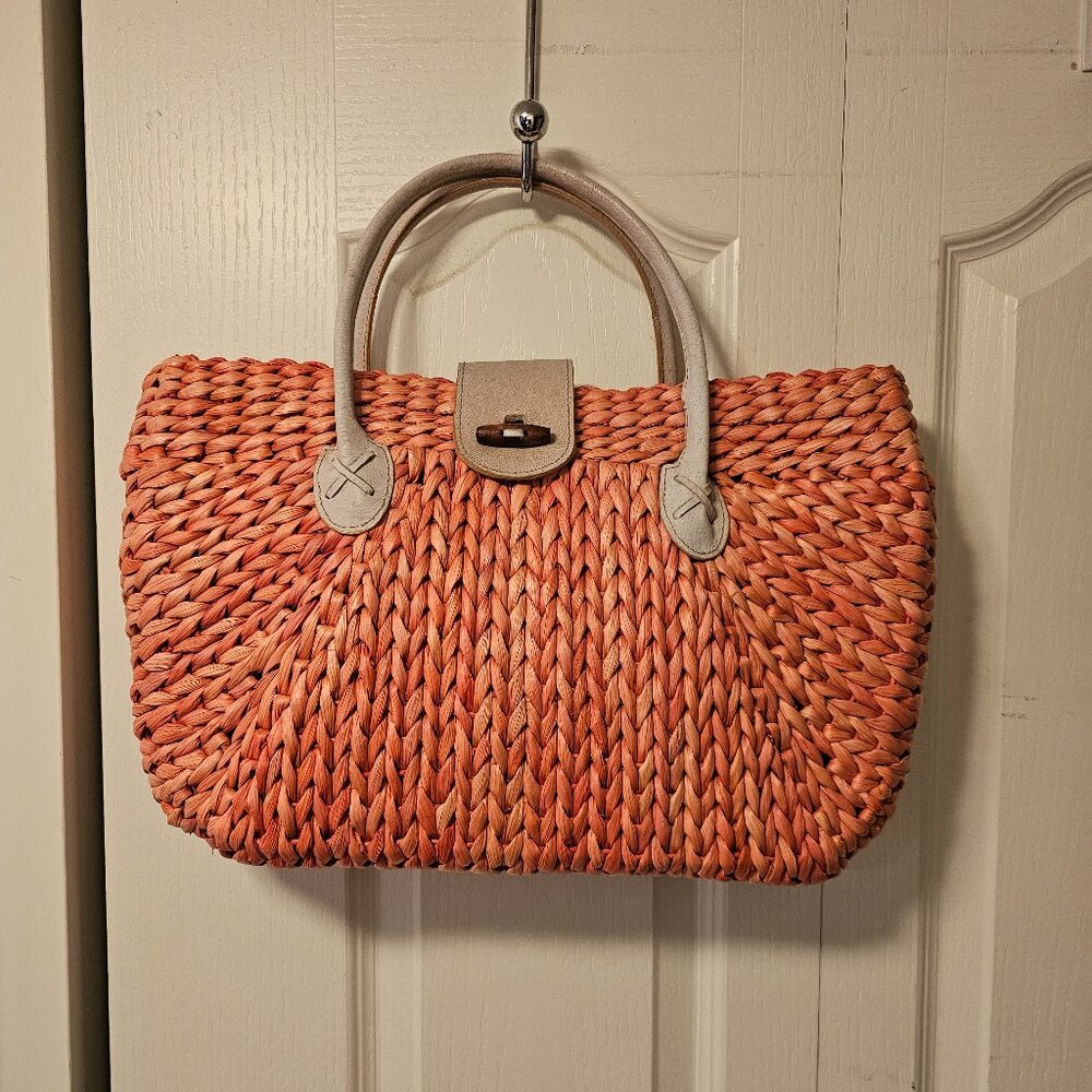 A. Giannetti casual straw bag.
